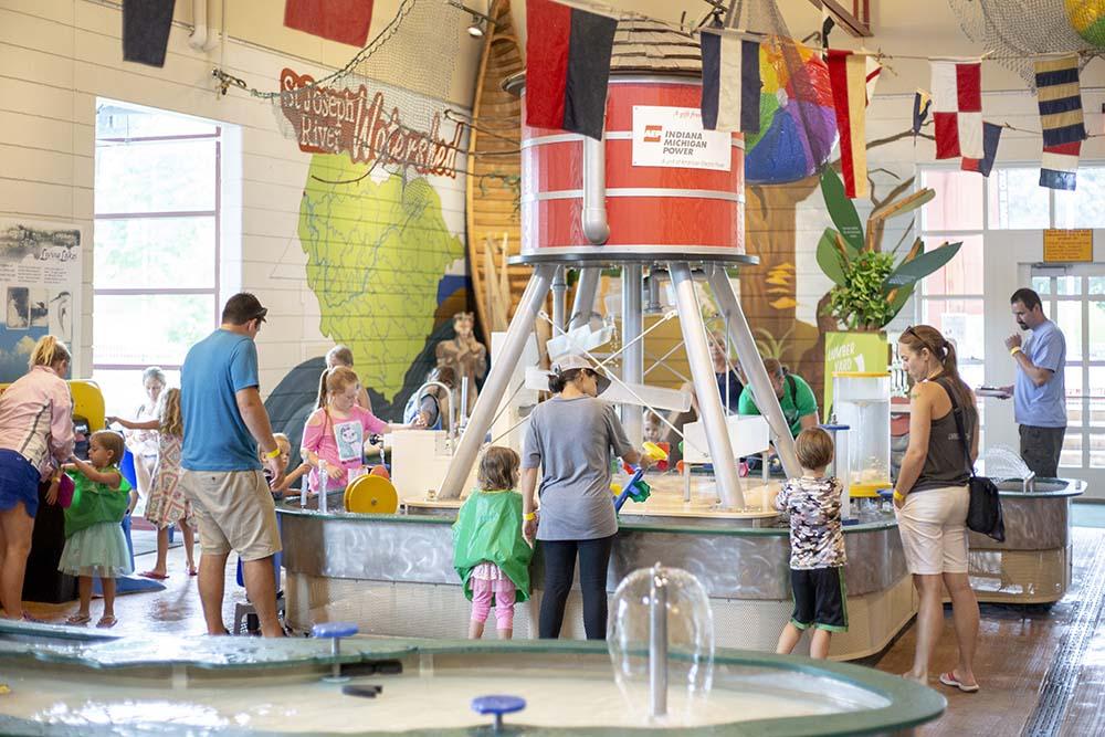 Families enjoying the exhibits at Curious Kids Discovery Zone