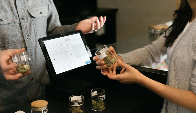 Customer at checkout at a dispensary. 