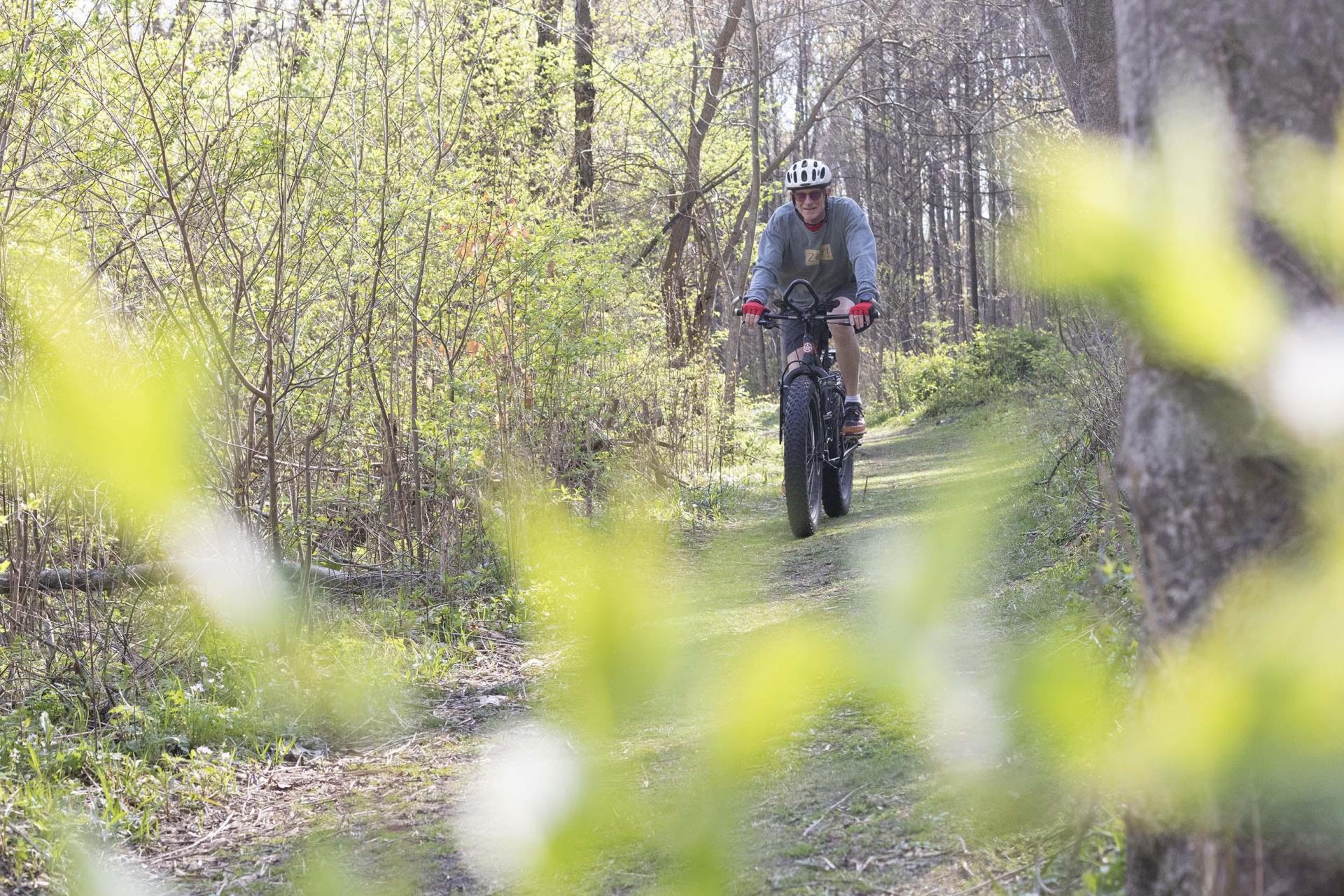 A person biking a trail at Love Creek.