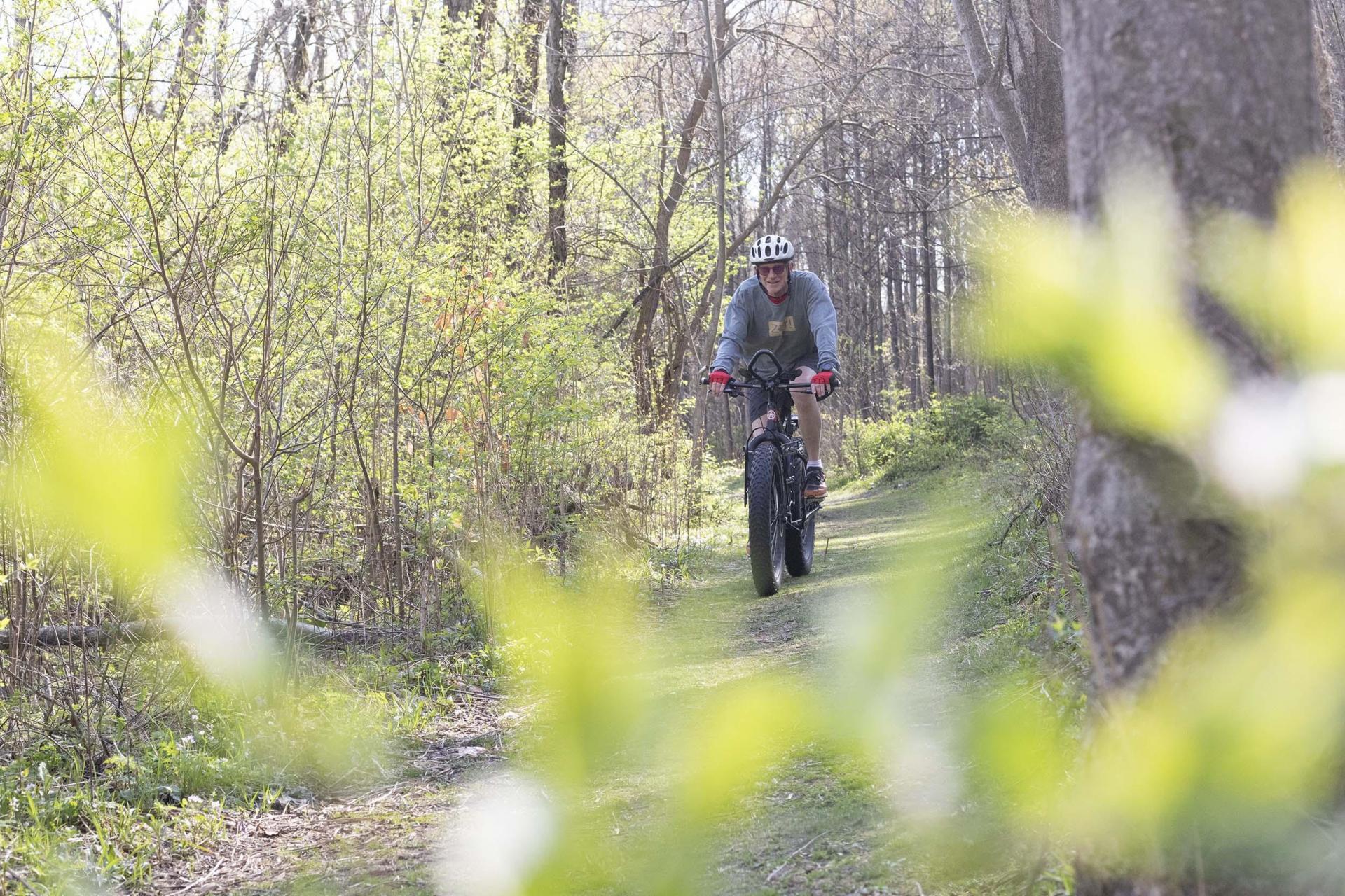 A person biking a trail at Love Creek.