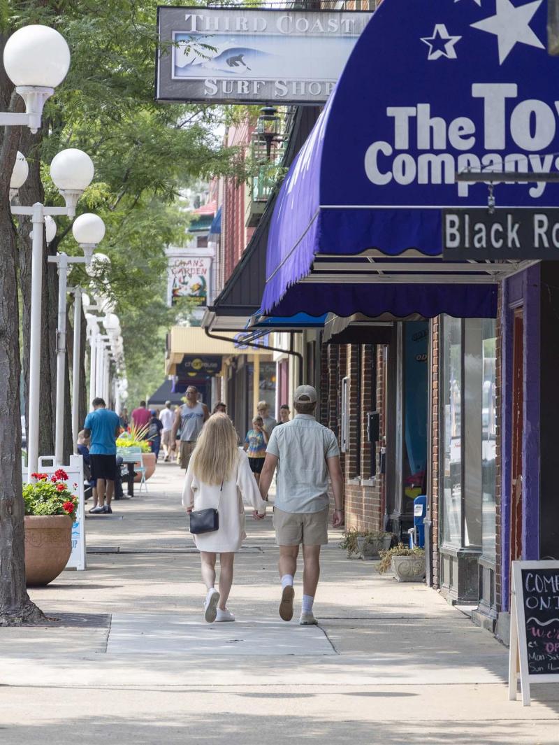 A couple walking in downtown Saint Joseph.