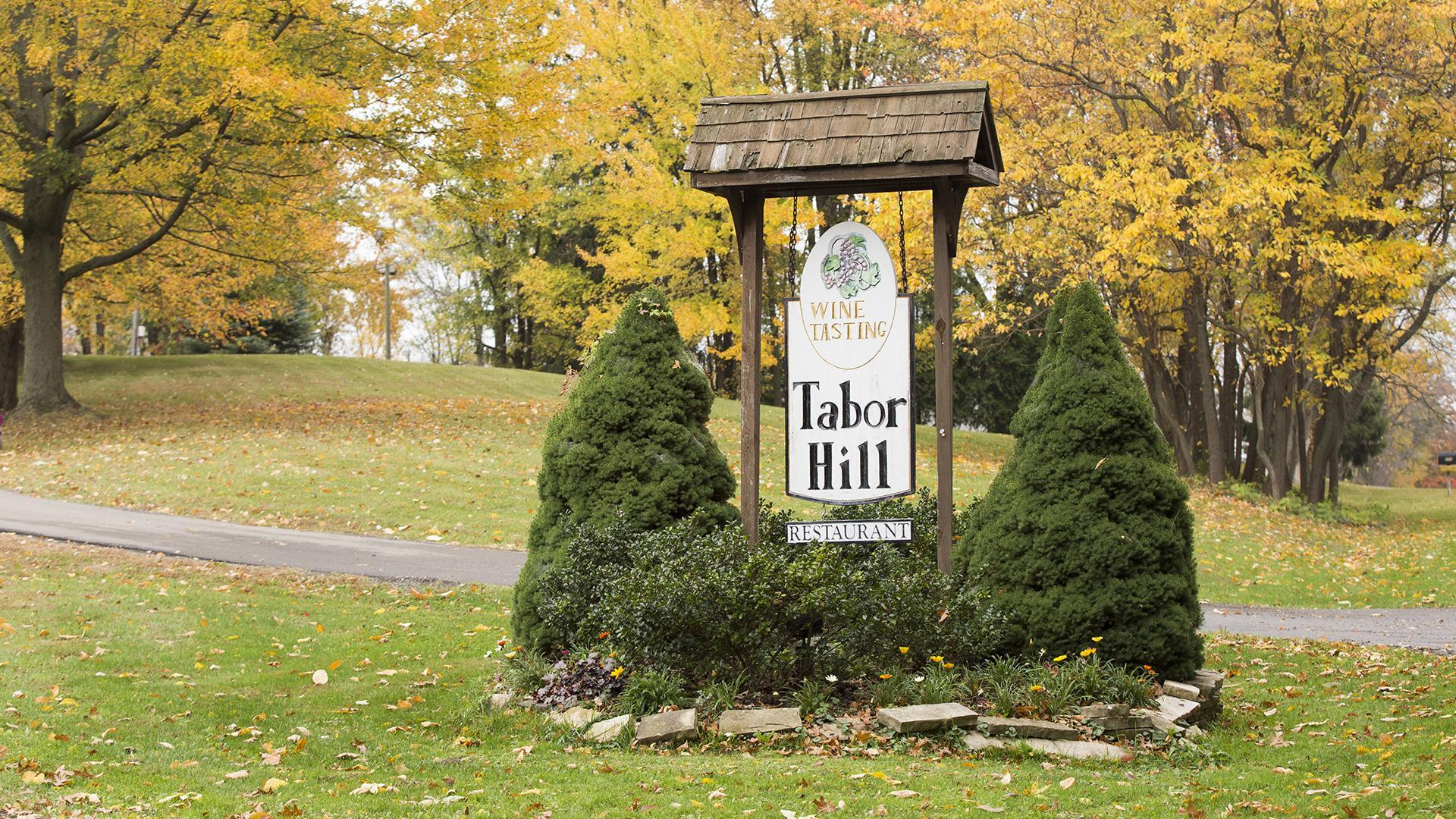 A wooden sign for Tabor Hill Winery and Restaurant
