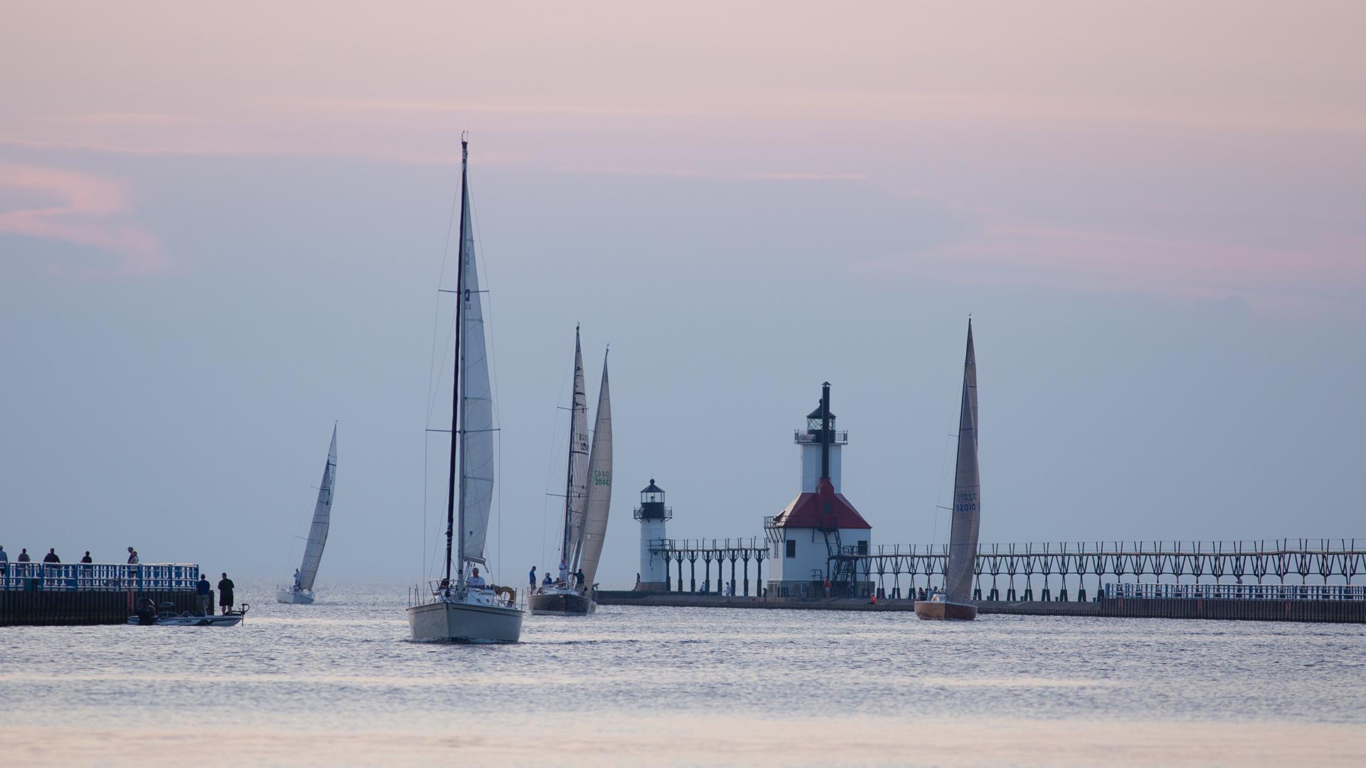 Sailboats between the piers