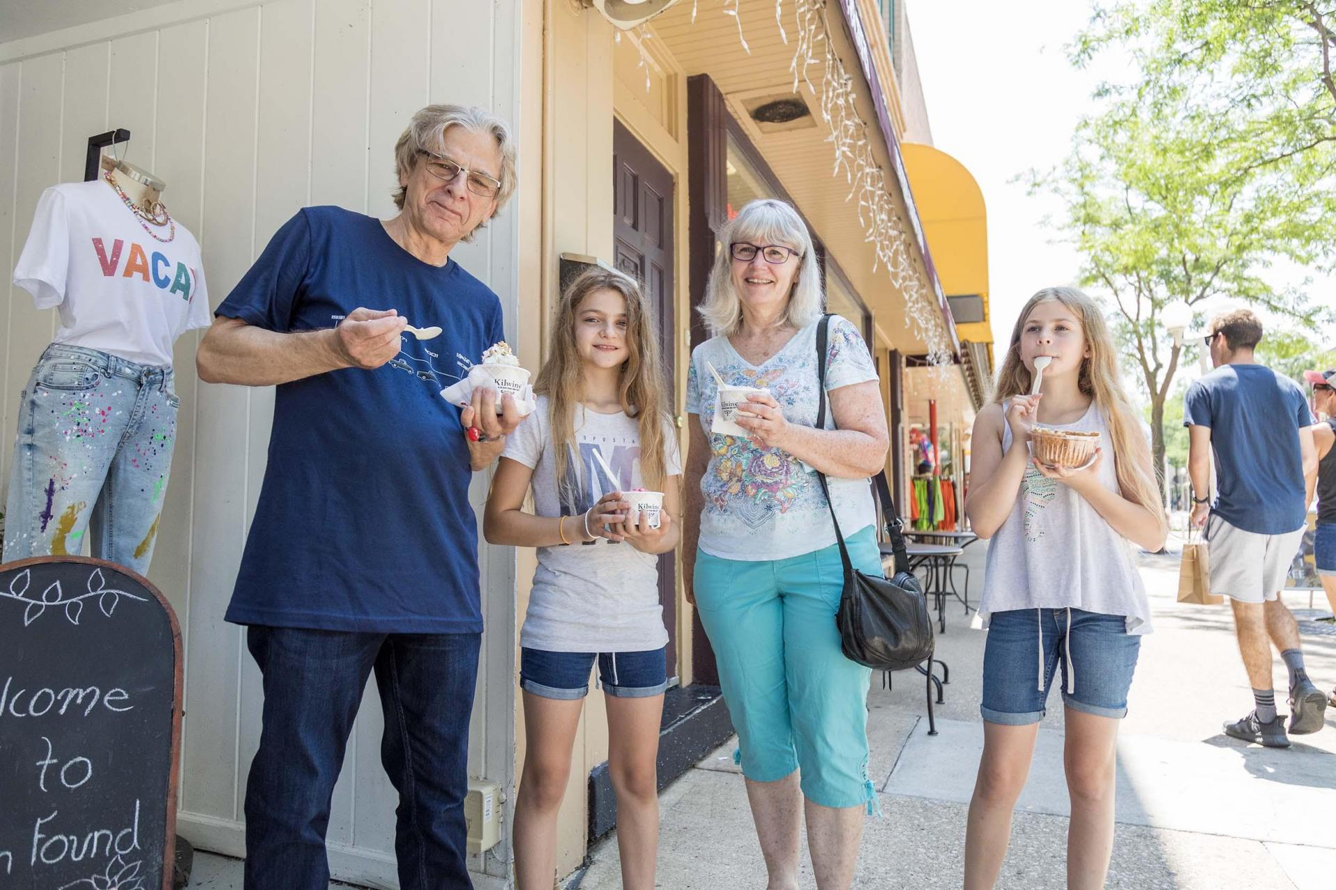 A group of people enjoying Kilwins ice cream