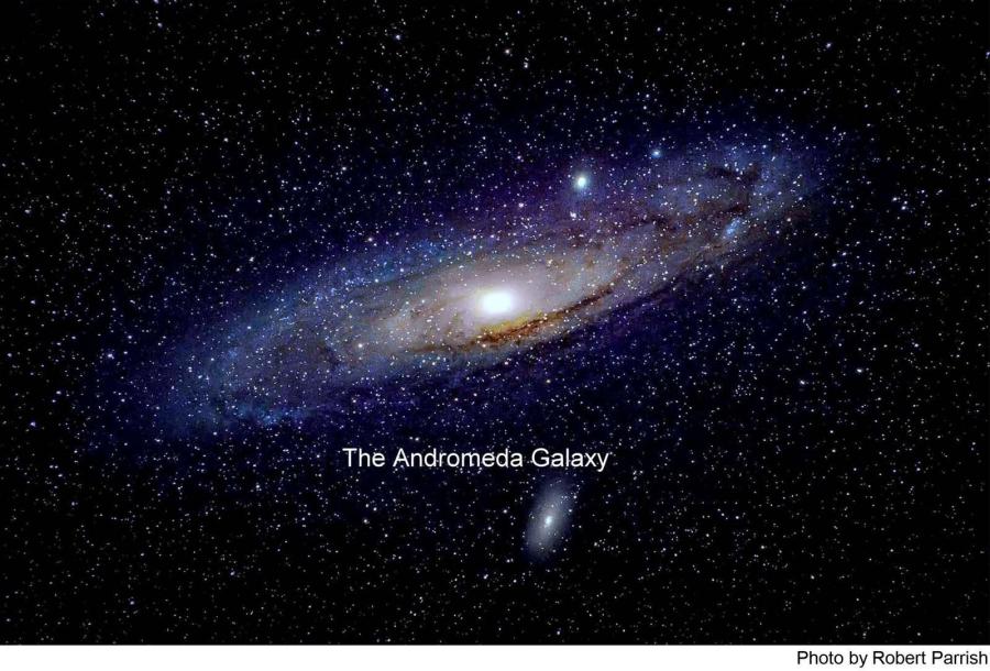 An image of the Andromeda Galaxy, showing its spiral structure against a star-filled background, with the text 'The Andromeda Galaxy' labeled underneath