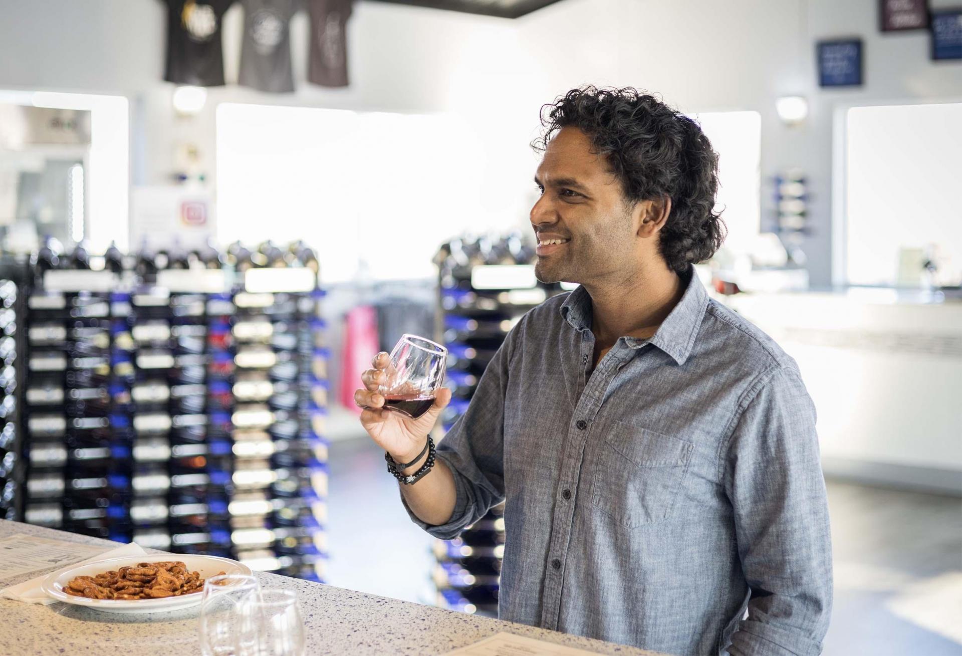 A person enjoying a wine tasting at Gravity Winery.