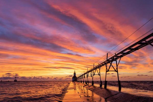 Vibrant sunset over the lighthouse in Saint Joseph.