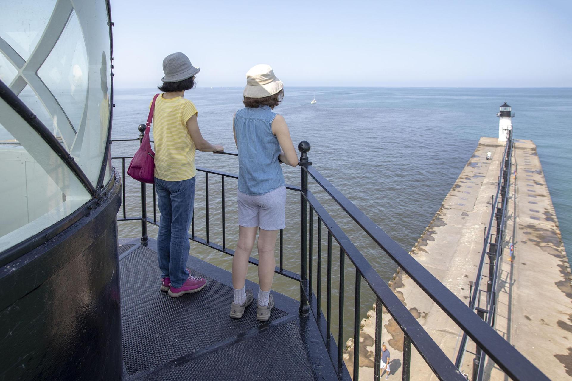 Two people enjoying the view from the Saint Joseph Lighthouse
