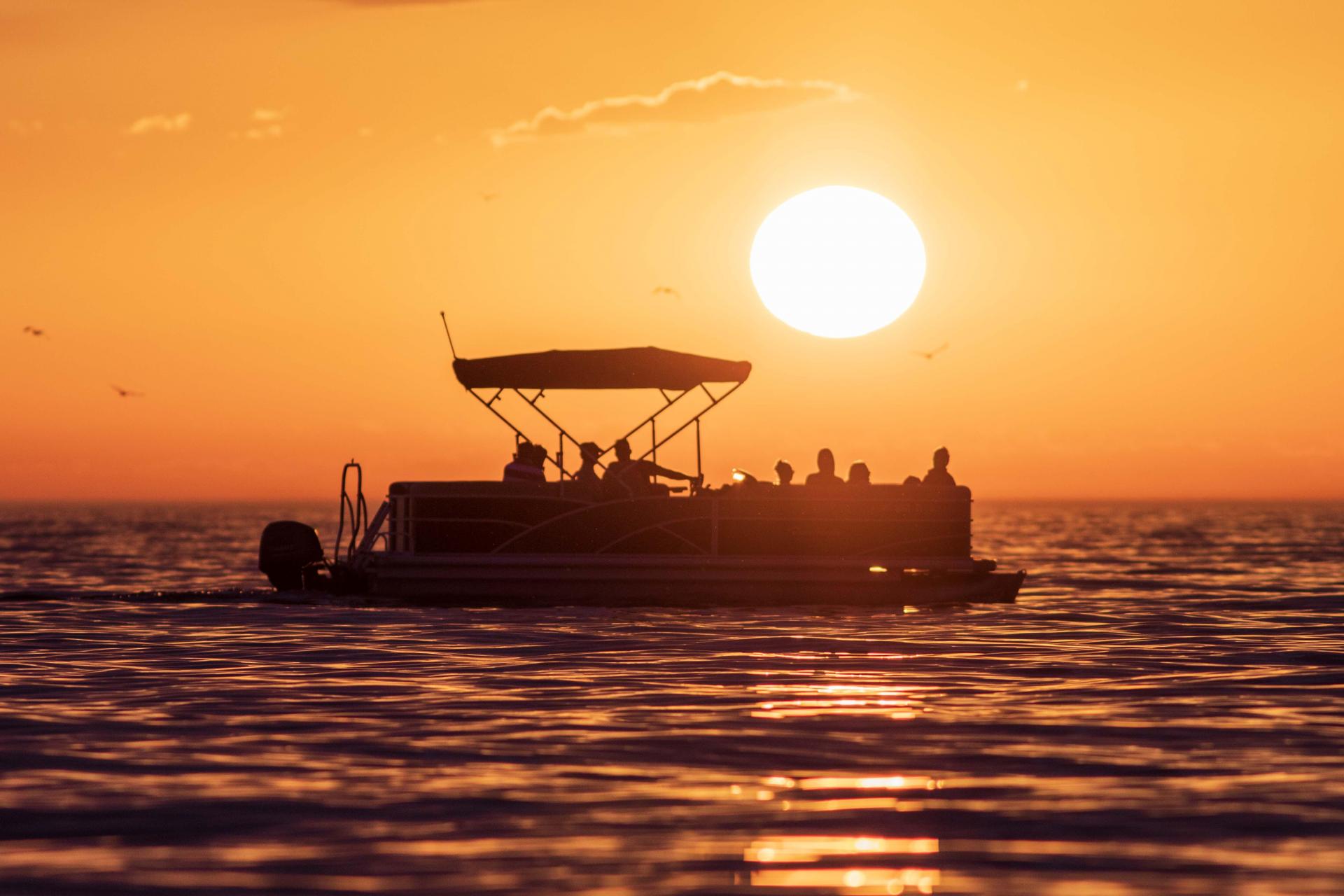 Pontoon on Lake Michigan at sunset.