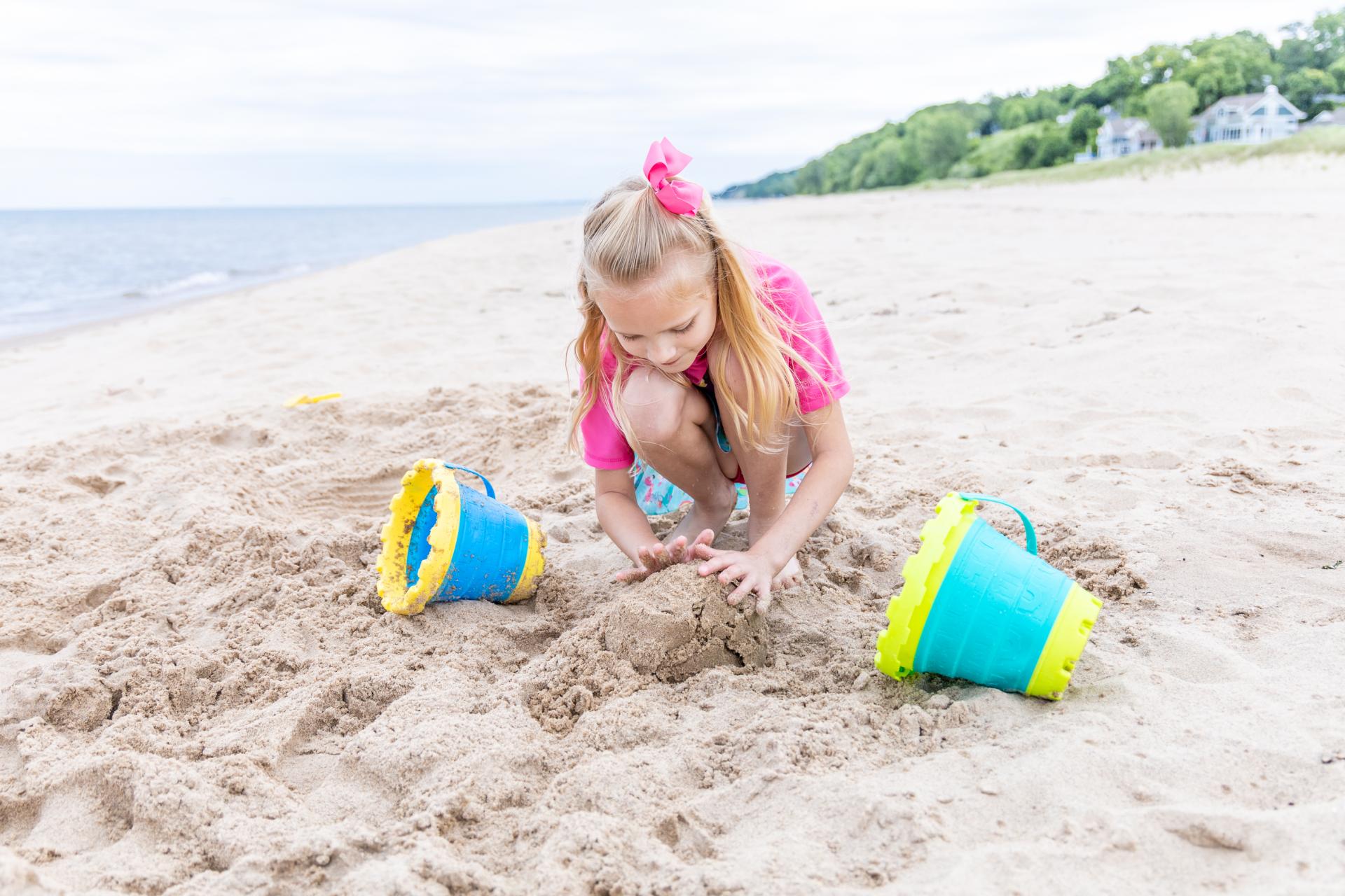 Girl playing in the sand