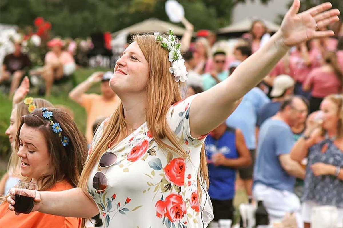 A woman dancing to the music at Live music outdoors at Round Barn.