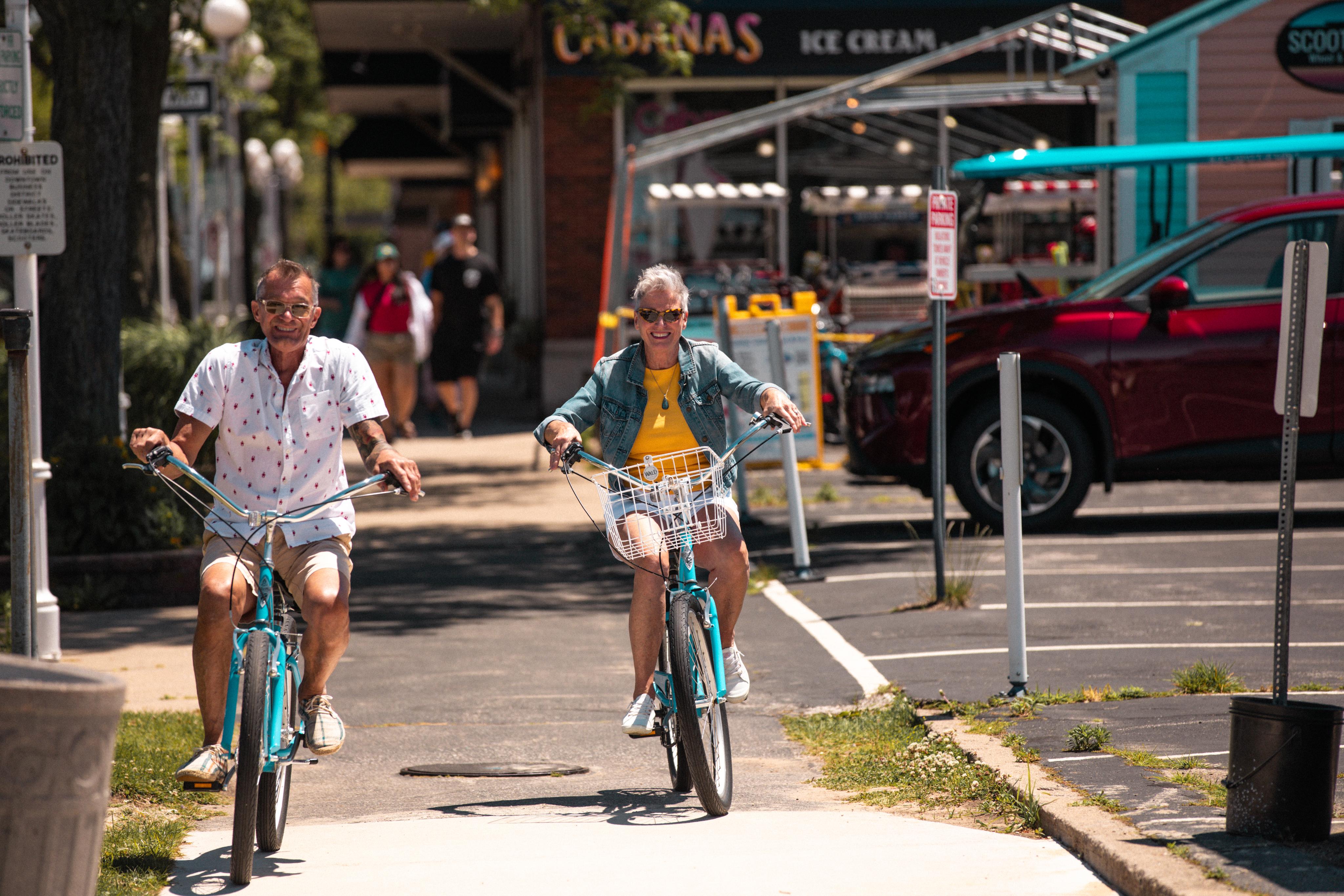 Couple riding bikes in St Joseph