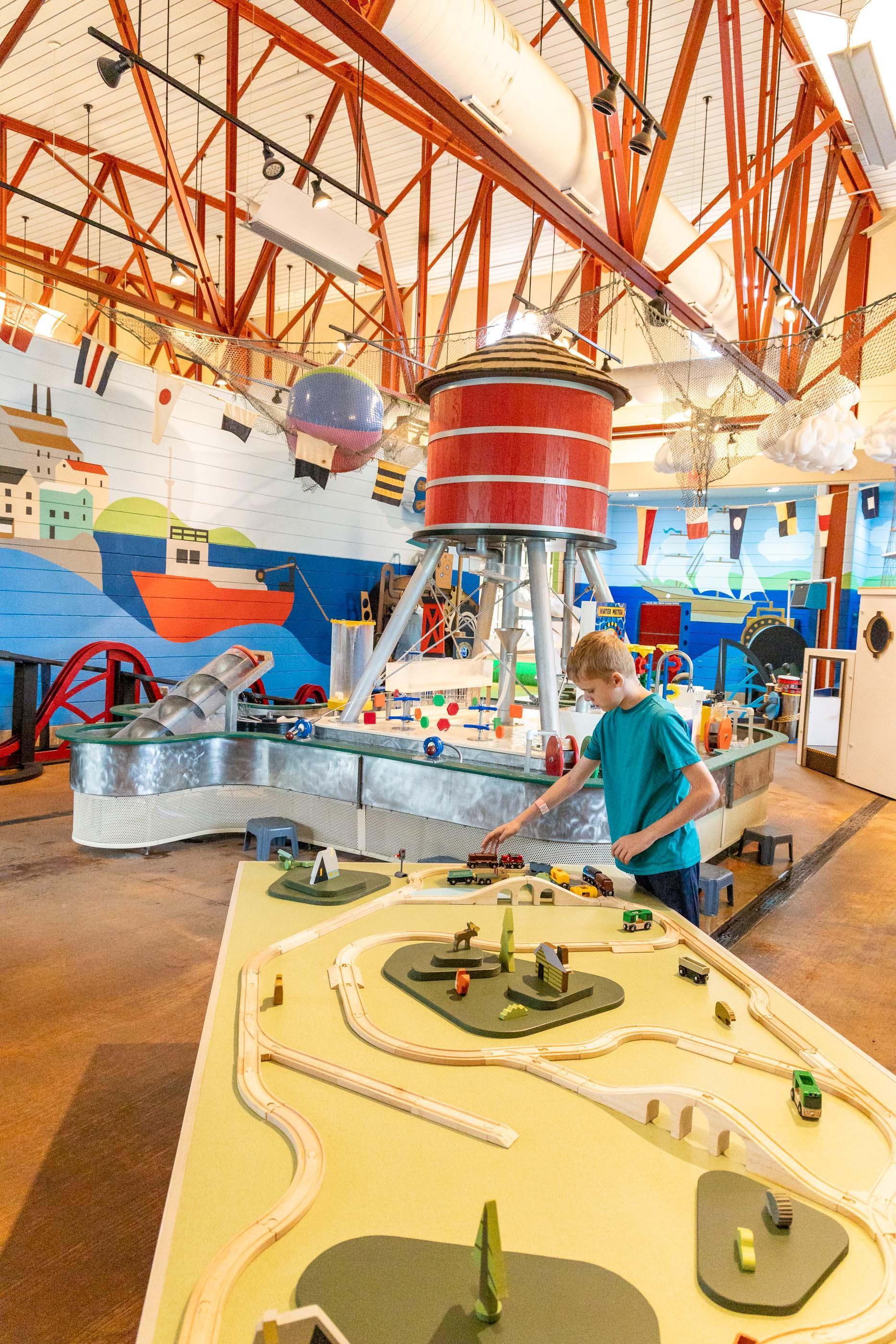 A child interacts with an exhibit at Curious Kids Discovery Zone.