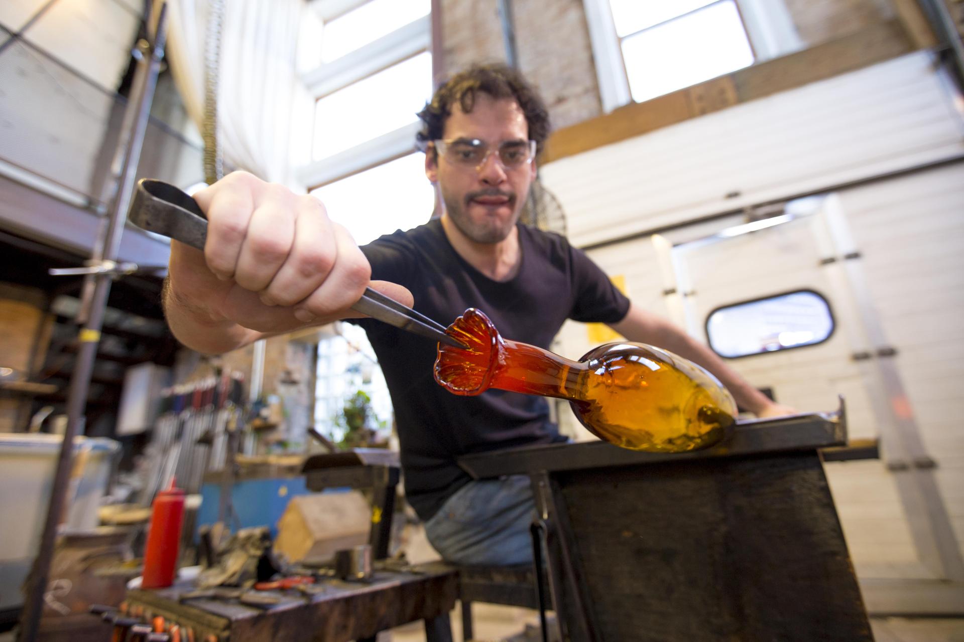 An artist at work at Water Street Glassworks.