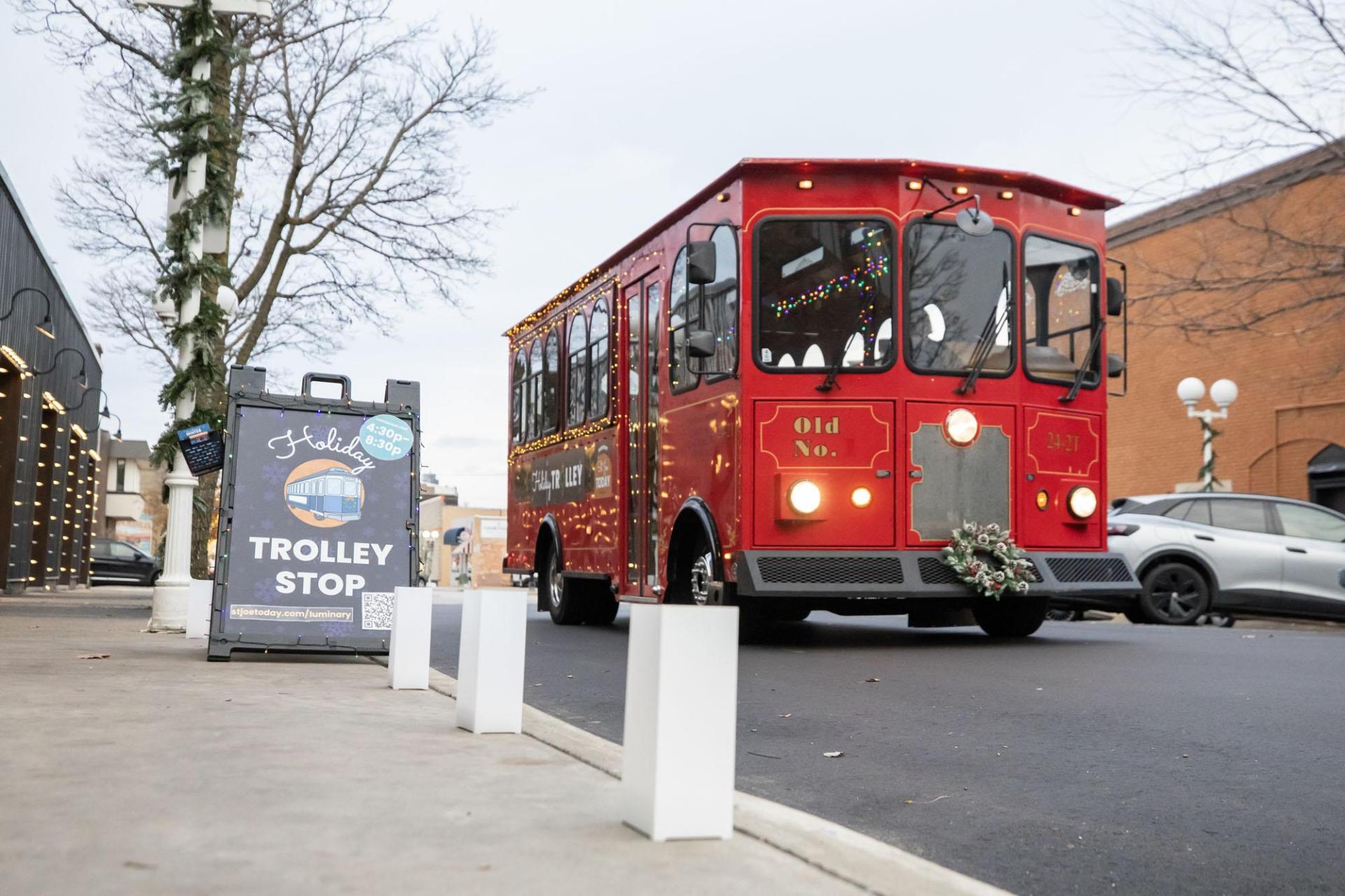 A holiday trolley adds cheer to Luminary in St. Joseph, MI.