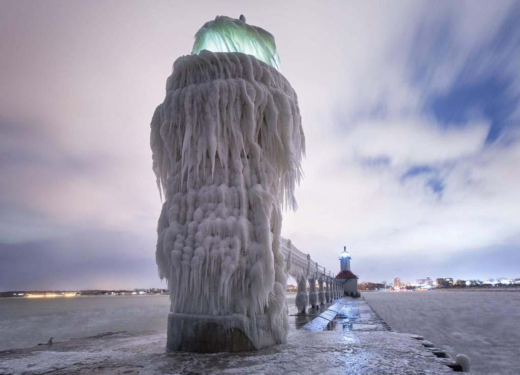 A view of the ice covered lighthouse in St. Joseph at night.
