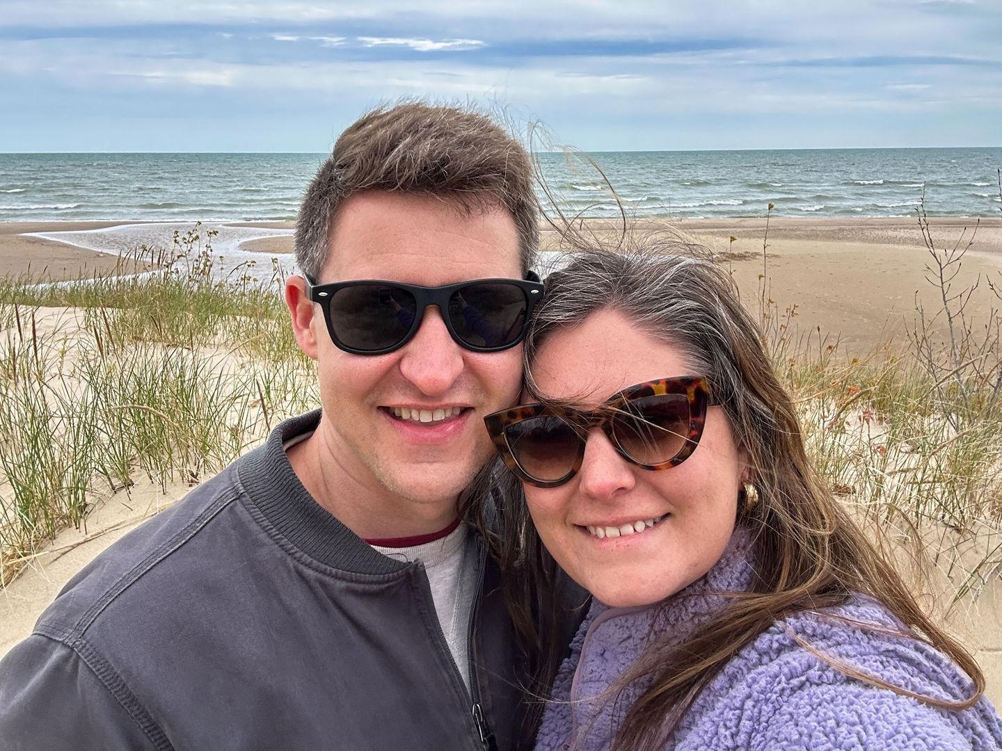 A couple stands on the beach at Warren Dunes State Park.