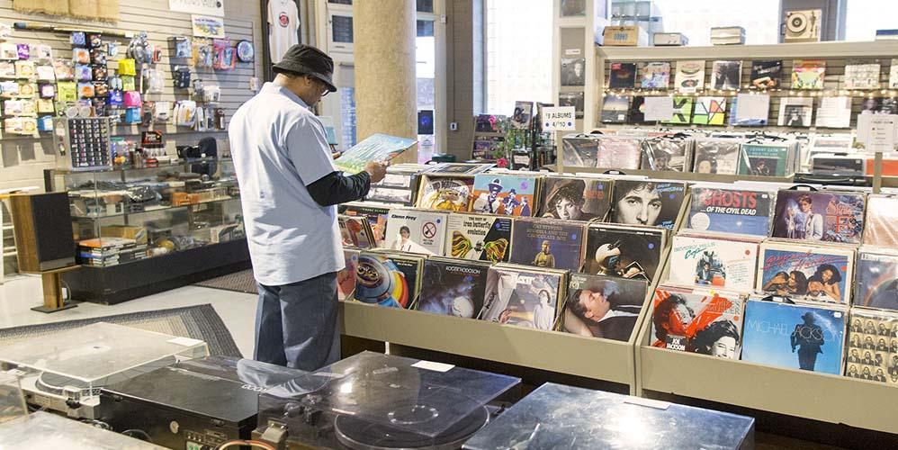 A person shopping at 3 Pillars Music