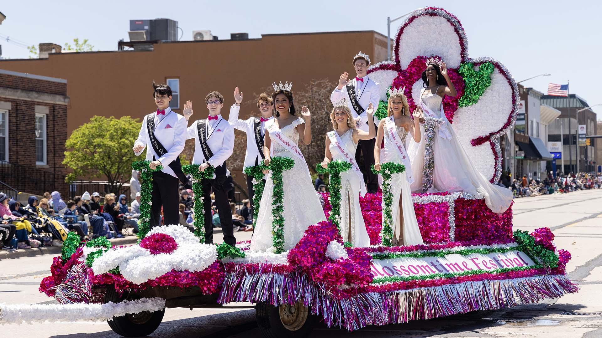 A colorful parade float passes through St. Joseph, Michigan during the Blossomtime Grand Floral Parade.