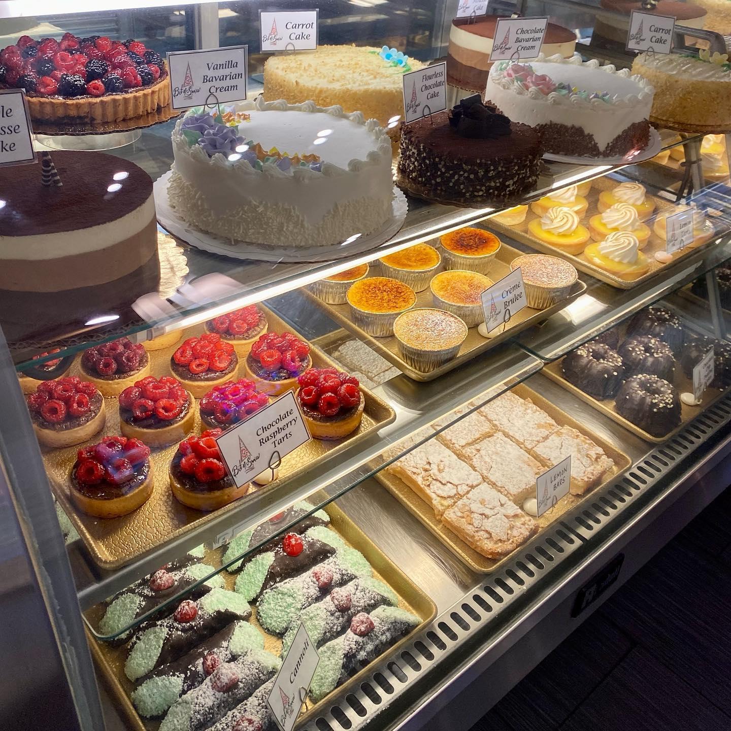 A display case filled with fresh desserts at Bit of Swiss.