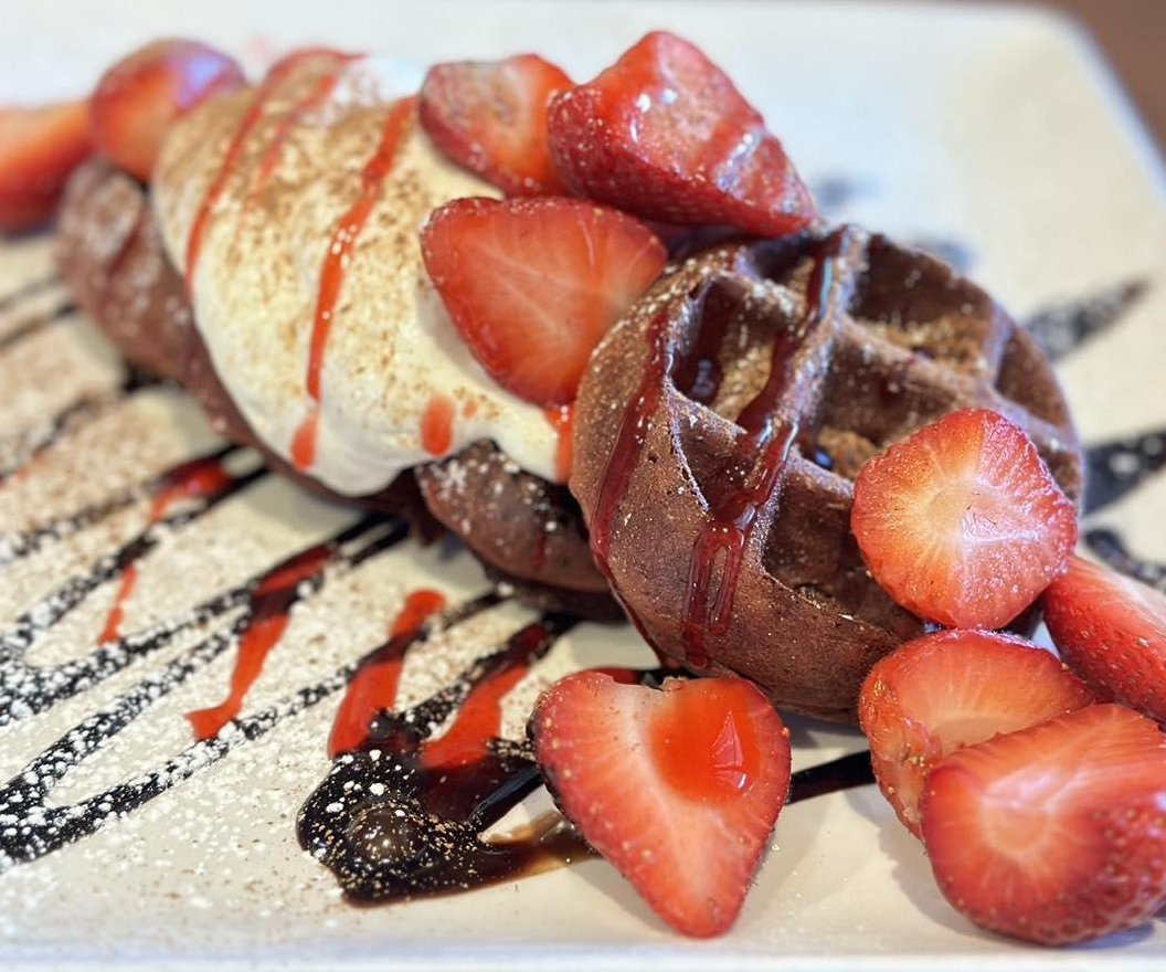 Mini chocolate waffles topped with fresh strawberries at Plank’s Tavern on the Water.