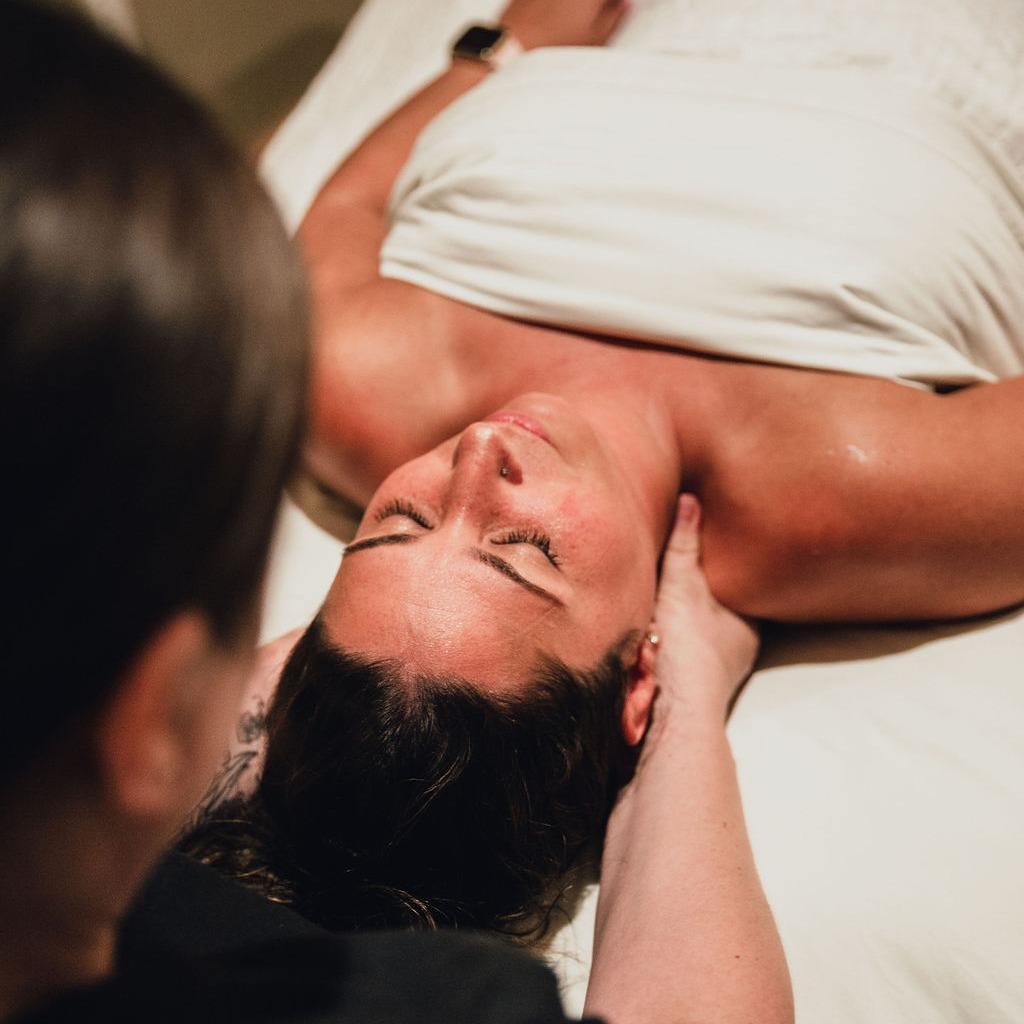 A woman receiving a massage at a spa
