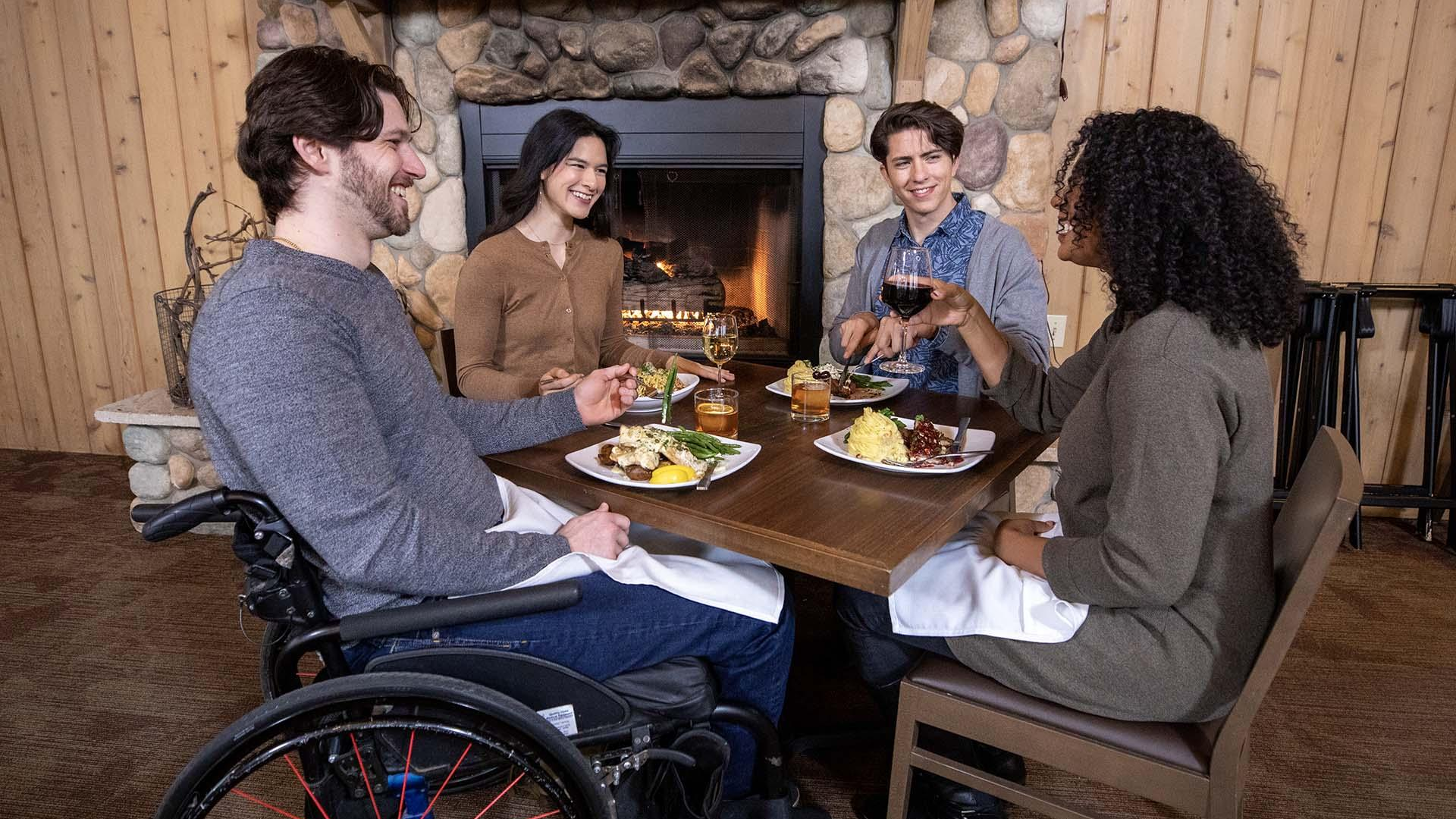 A group of friends enjoying a meal at Tabor Hill.