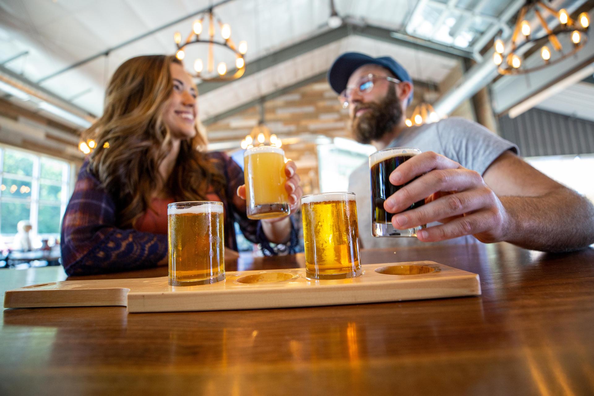 Couple drinking at Makers Trail location