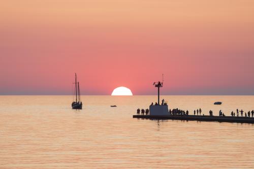Tall Ship MJ on Lake Michigan at sunset.