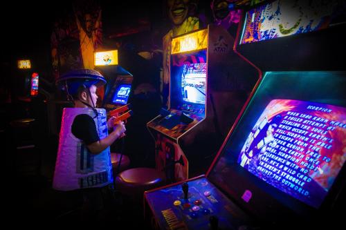 A child plays a video game in the arcade at Nardo's Pizza.