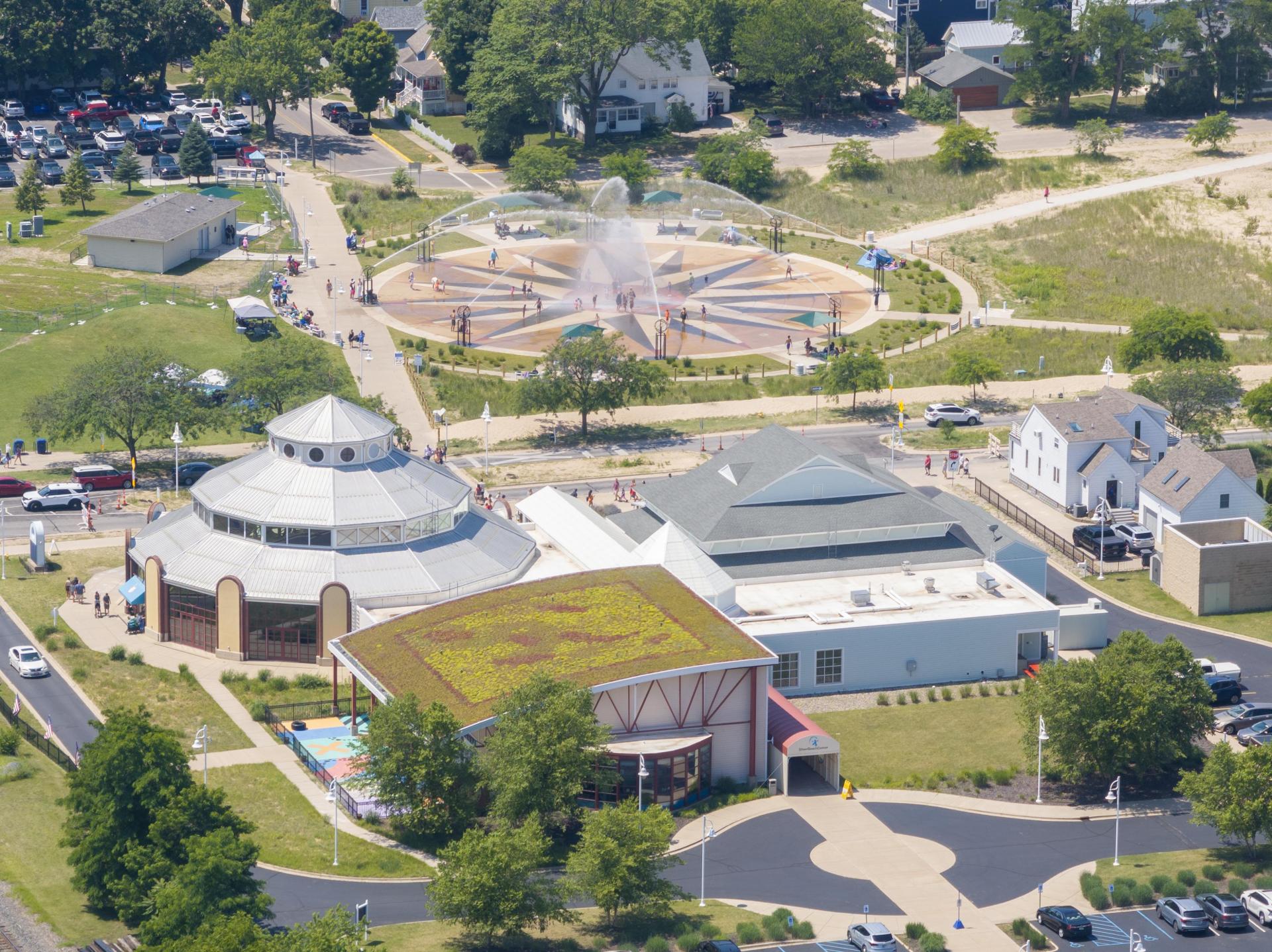 An aerial view of the Whirlpool Compass Fountain in summer with the Silver Beach Center nearby.