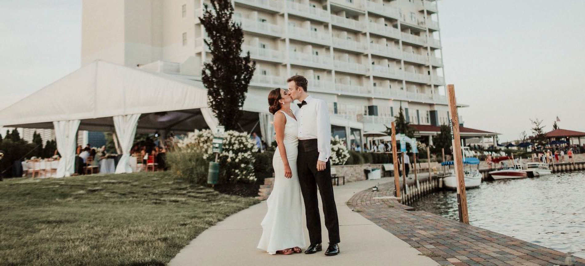 Couple posing in front of hotel 