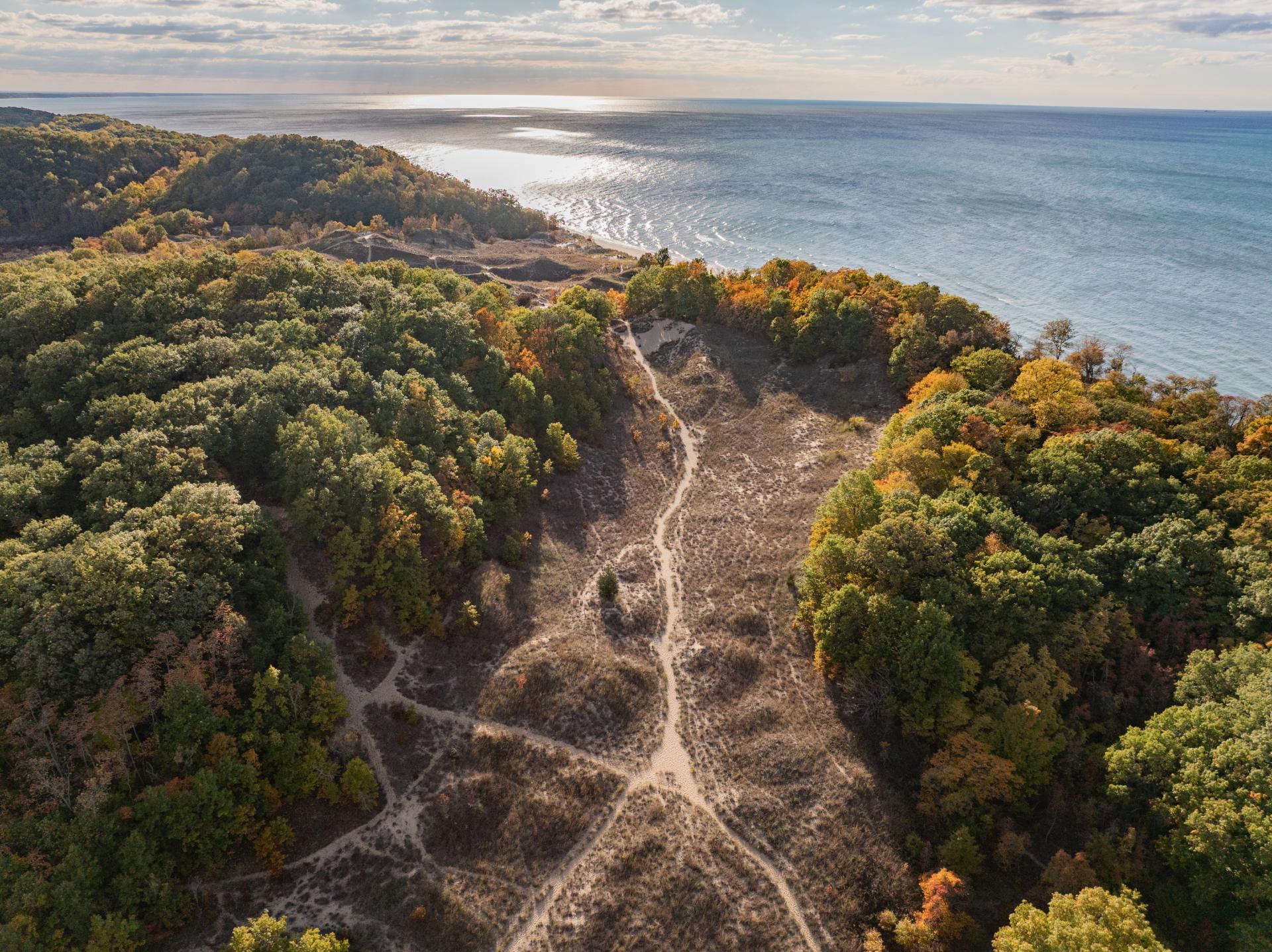 An aerial view of the dunes and trails at Grand Mere State Park in the fall.
