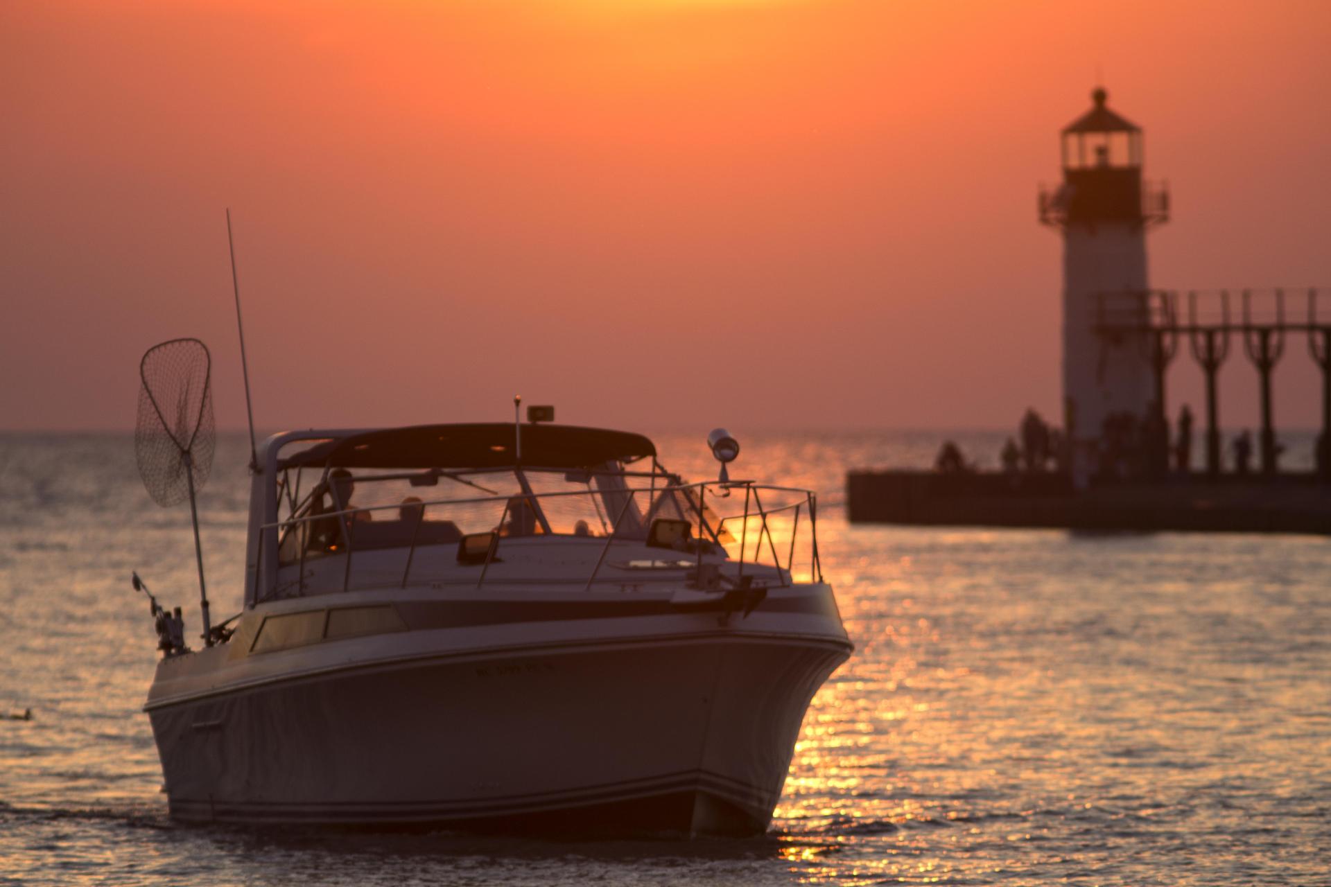 A fishing boat heads through the St. Joseph River Channel at sunset.