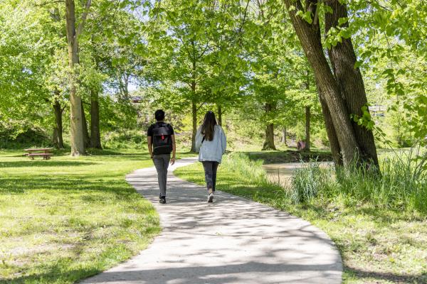 Two people walking at Flaherty Park.