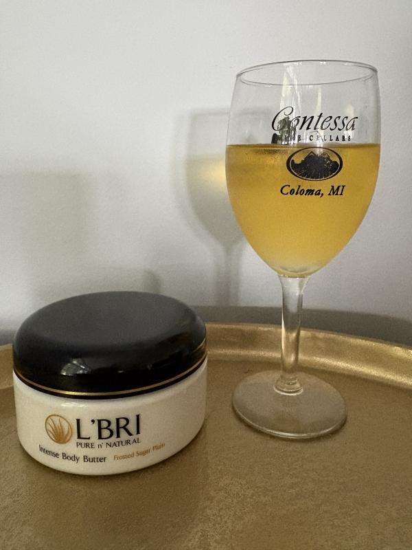 Glass of wine with body butter from L'BRI