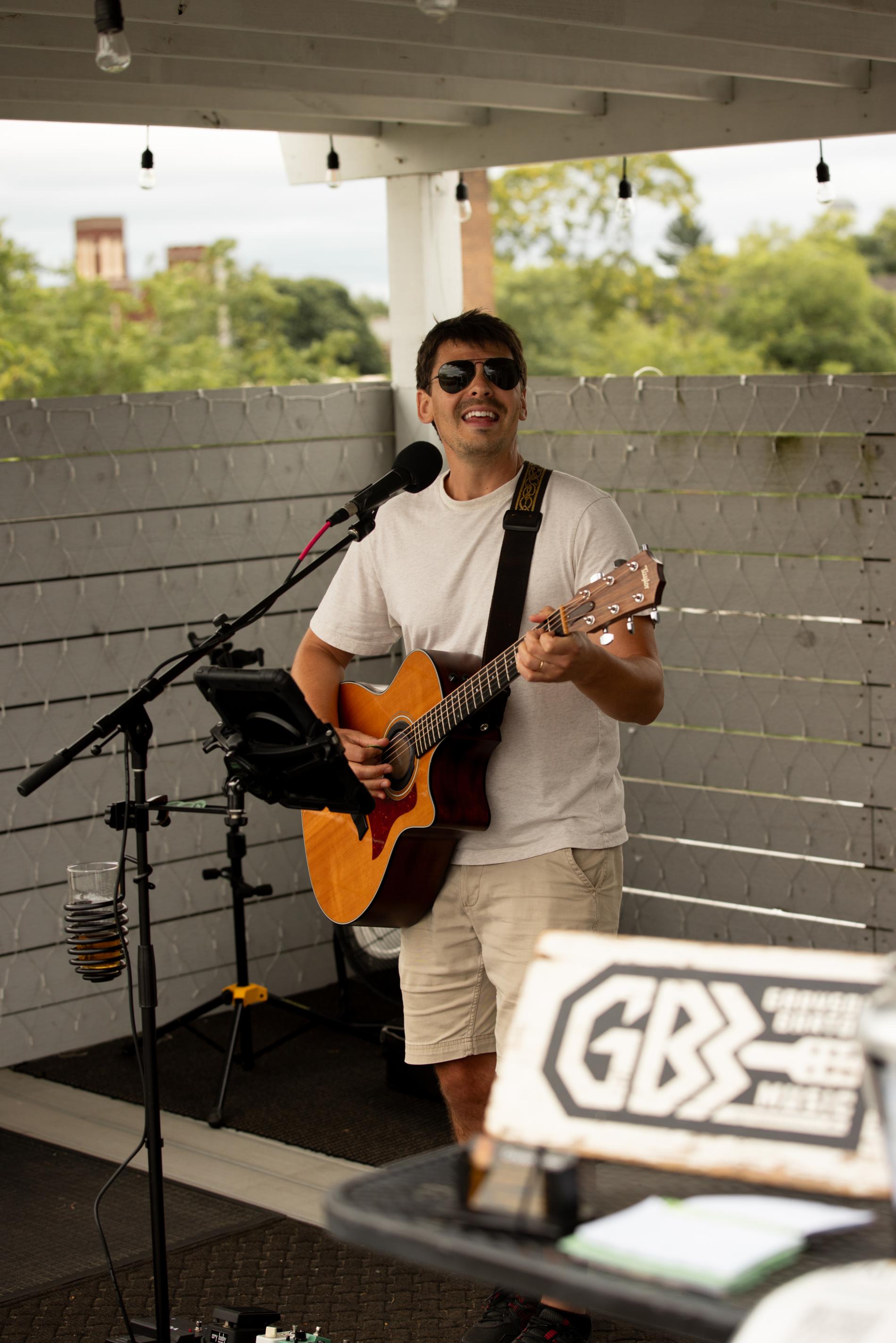 A musician performs on the rooftop at RyeBells in St. Joseph, Michigan.