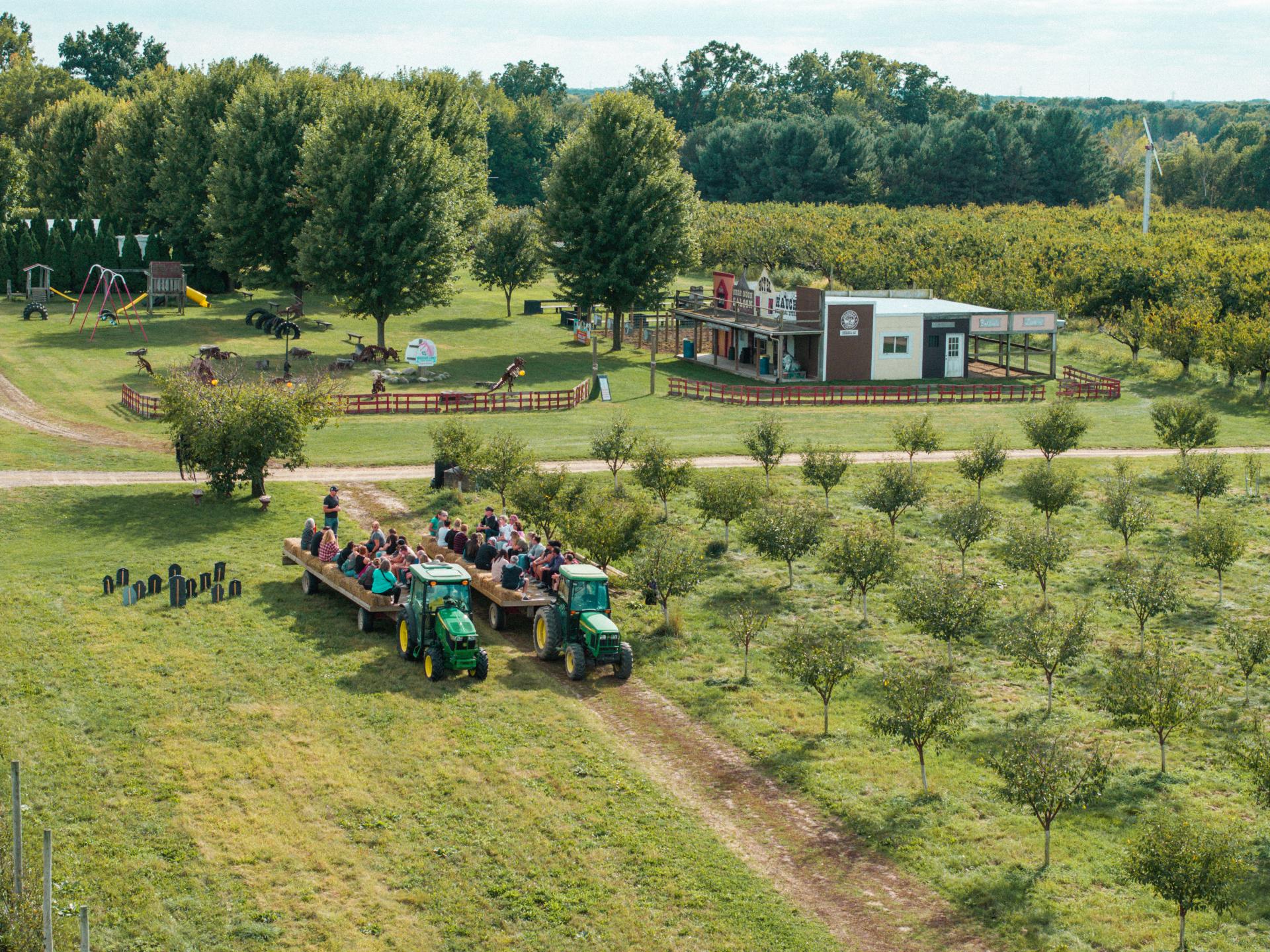 People prepare for a fall hayride at Jollay Orchards.