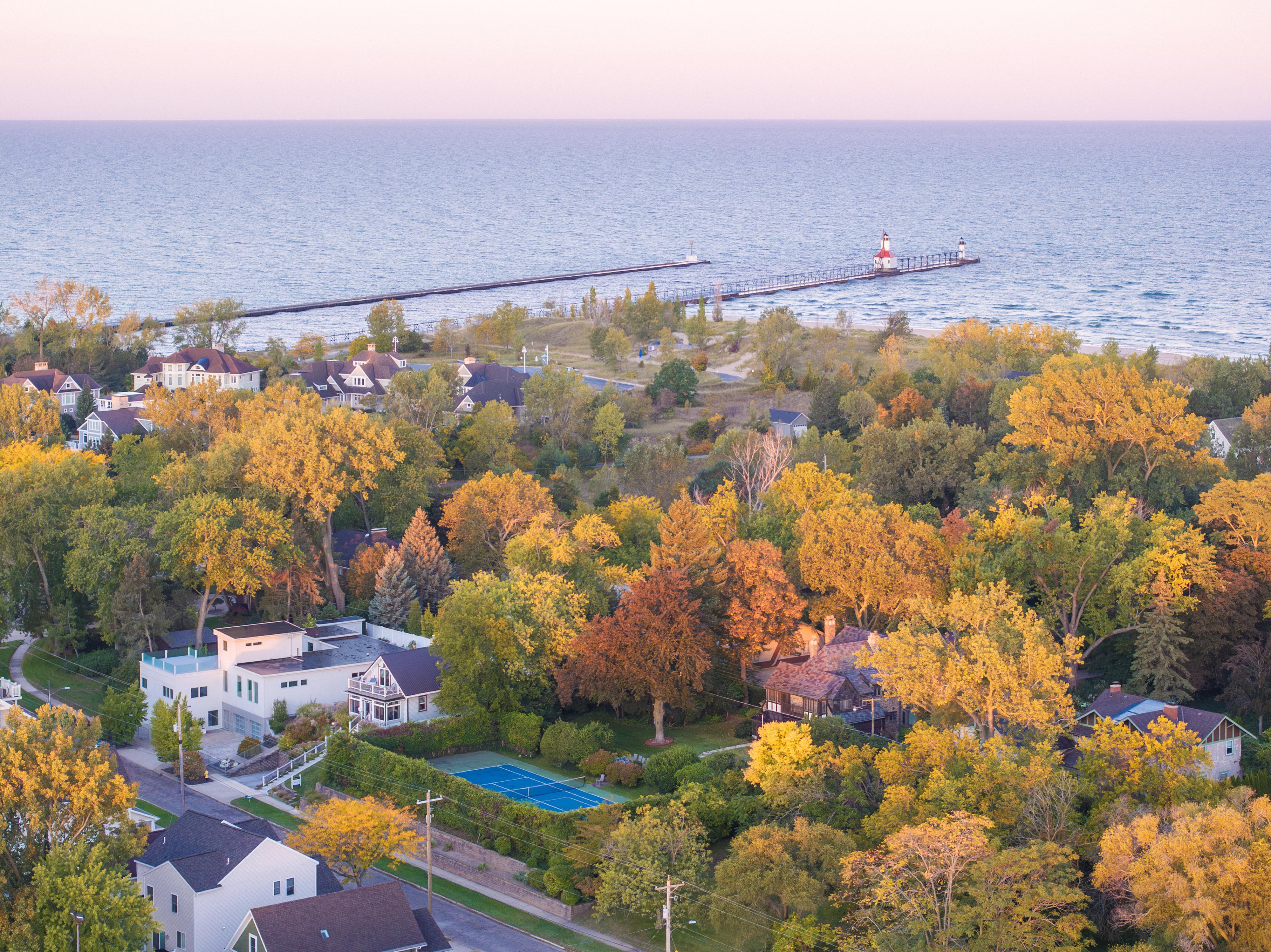 Early morning fall colors in St. Joseph, Michigan, with Lake Michigan and the lighthouse in the distance.