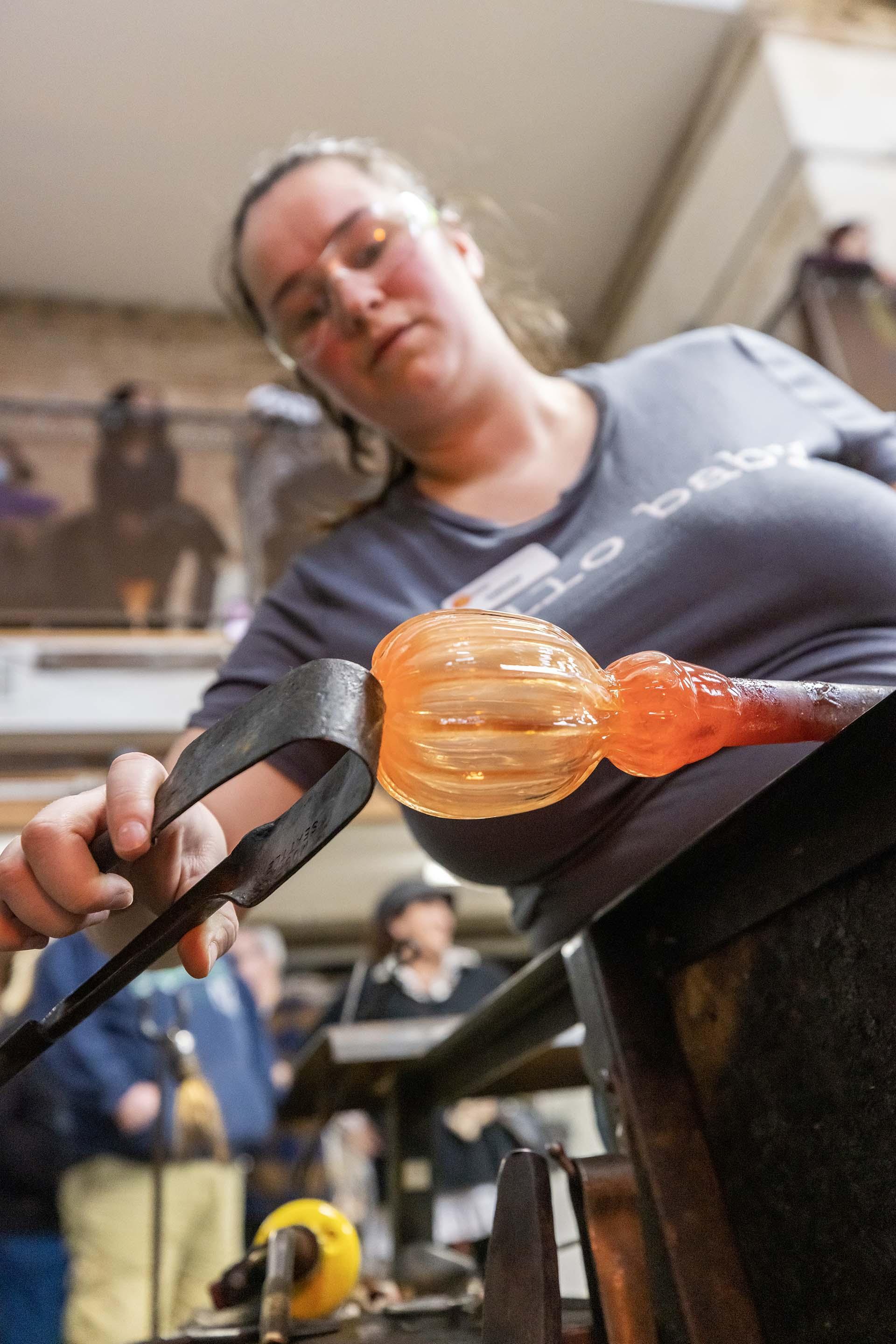 An artist working at the Water Street Glassworks