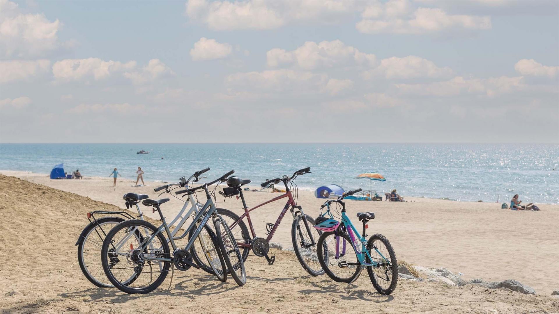 Bikes parked near the beach.