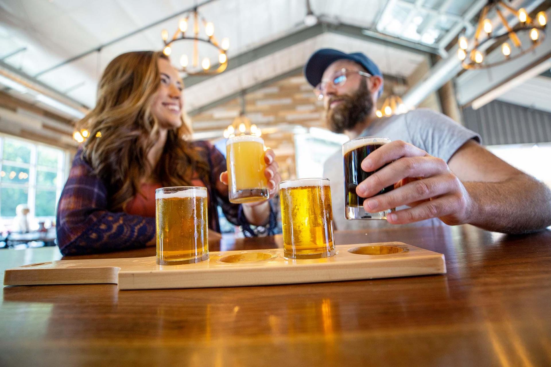 People enjoying beers at Ghost Isle Brewery.