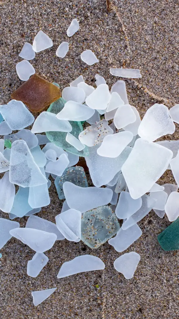 A pile of beach glass on the sand
