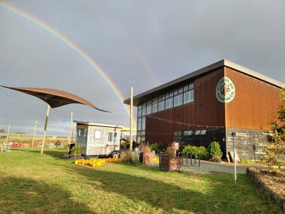 A rainbow beams over RSJ after a summer storm