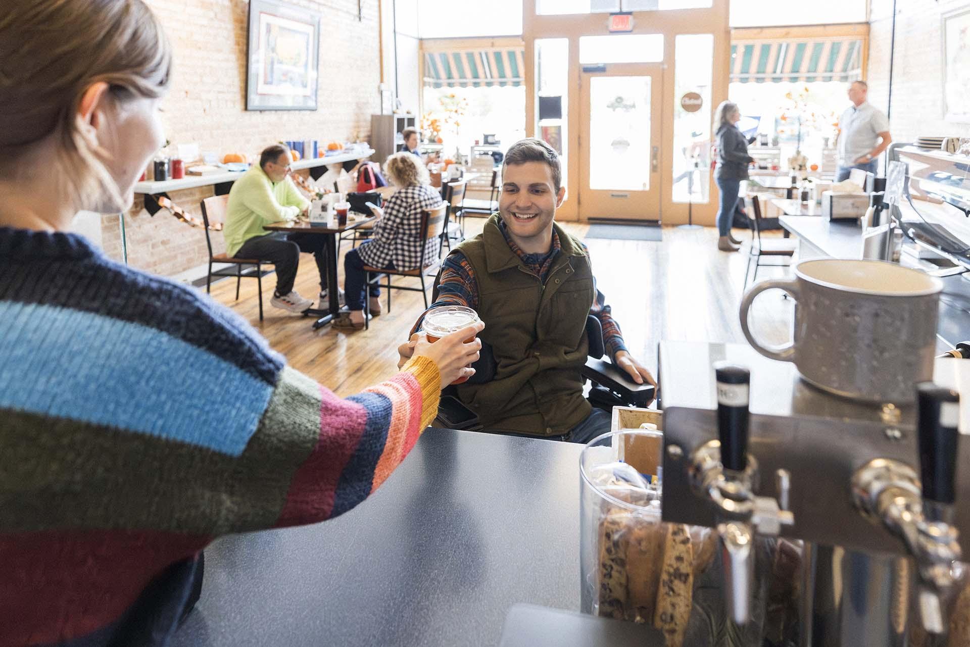 A person getting coffee at Forte