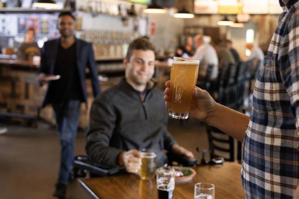 Friends enjoying beers at Watermark.