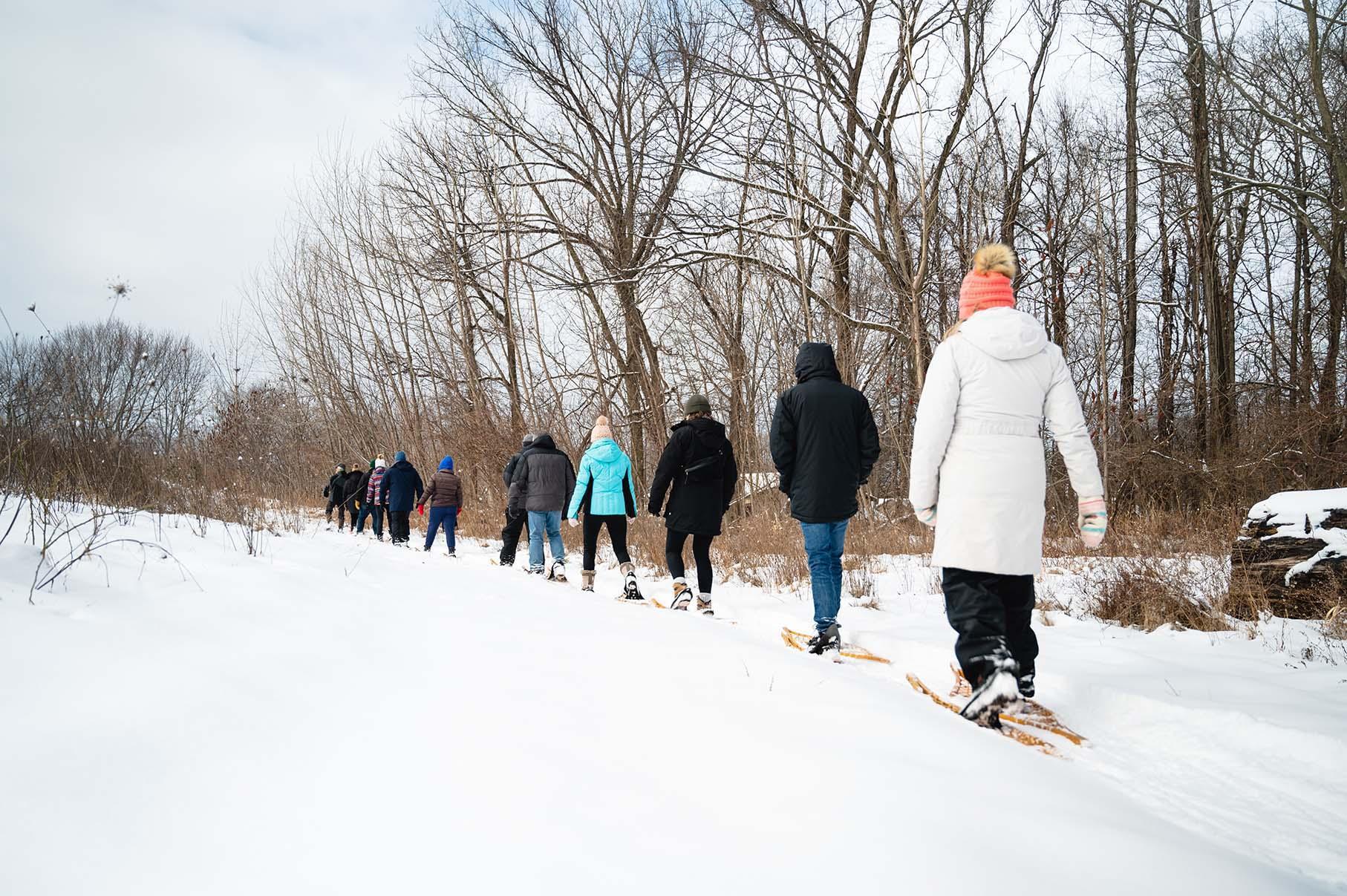 A group snowshoeing at Dablon.