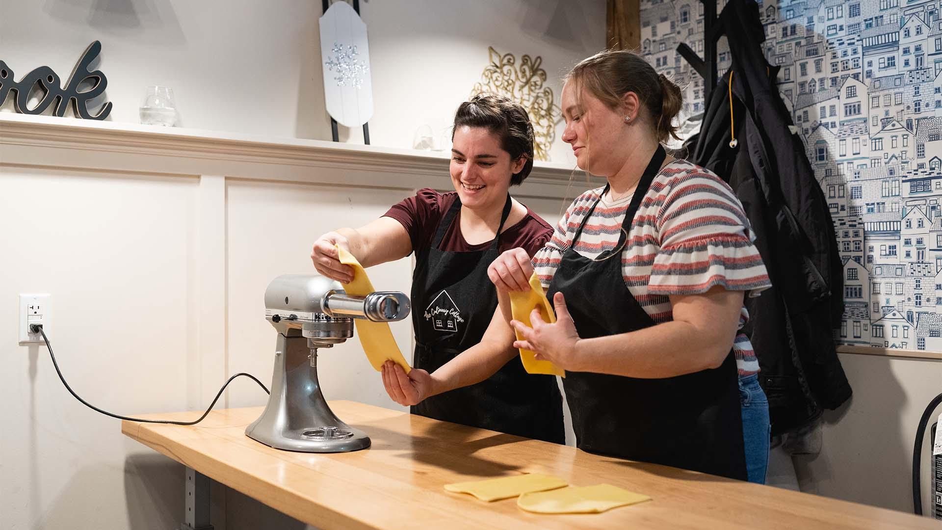 Two people enjoying a class at The Culinary Cottage