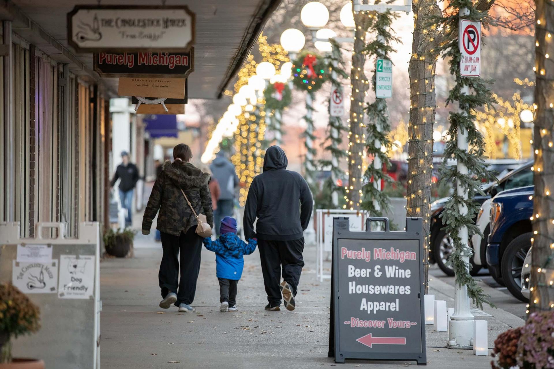 A family taking a walk in downtown St. Joseph.