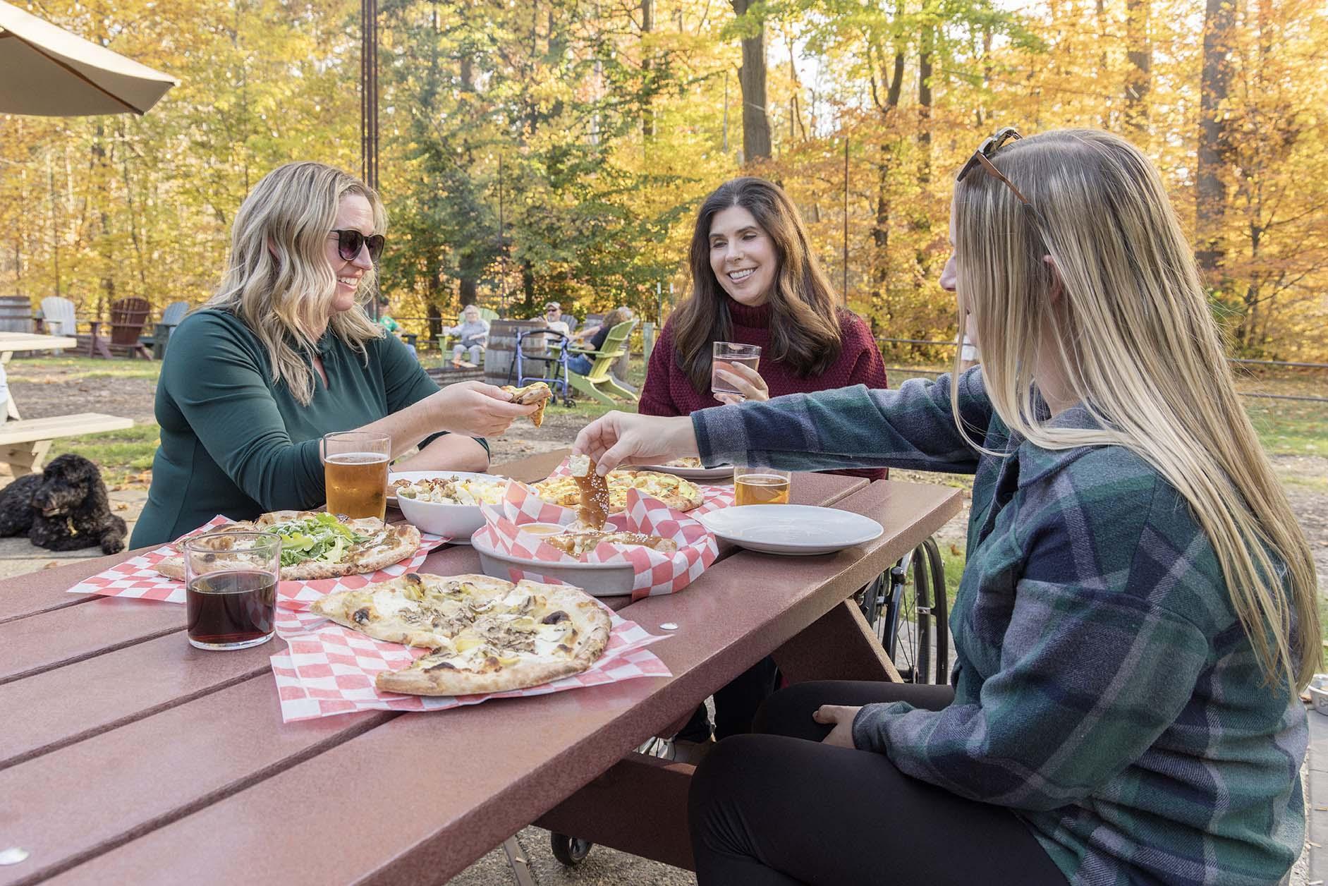 Friends enjoying pizza at Haymarket